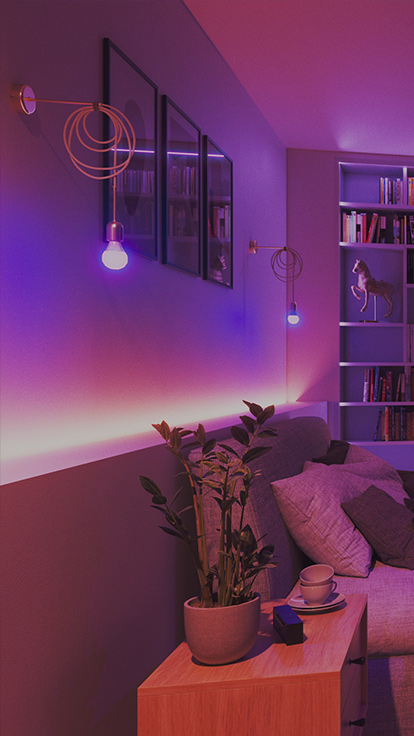 This is an image of Nanoleaf Essentials A19 Bulbs in a bedroom. The light fixture is on the wall behind the bed. The smart color changing LED light bulbs have over 16 million colors and the perfect bedroom lights to set the ideal ambience.