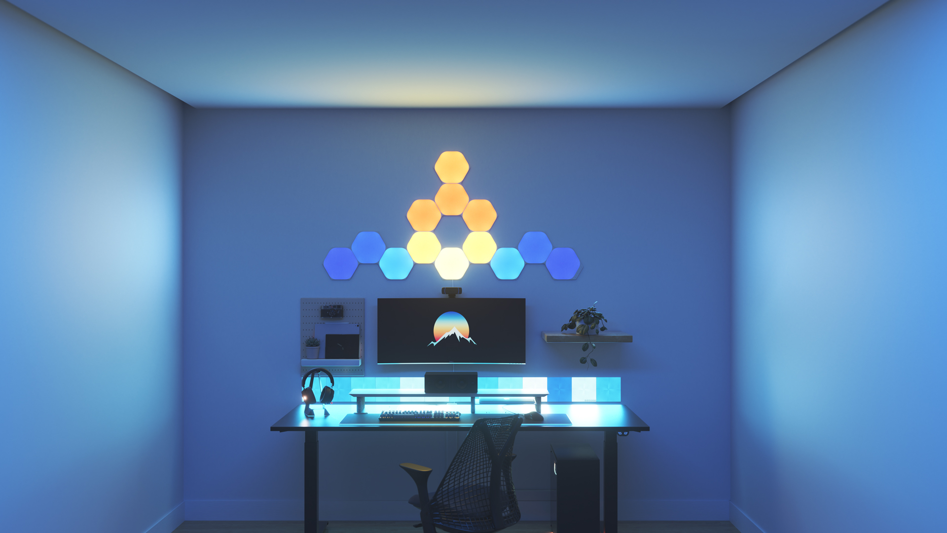 Kawaii style gaming setup with Nanoleaf Shapes Hexagon smart home RGB light panels above the PC monitor. The perfect smart lights to complete the gamer aesthetic.