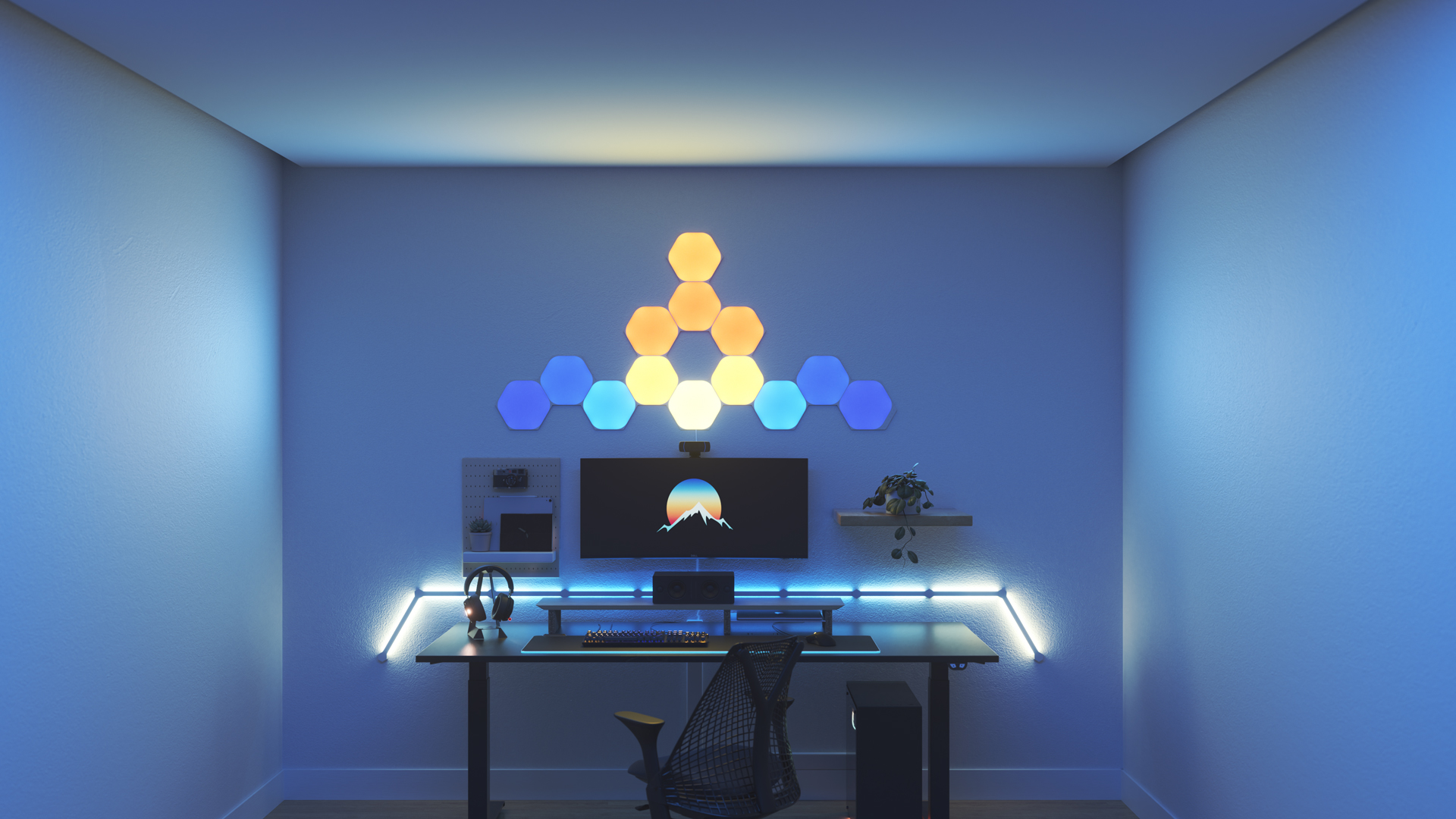 Kawaii style gaming setup with Nanoleaf Shapes Hexagon smart home RGB light panels above the PC monitor. The perfect smart lights to complete the gamer aesthetic.