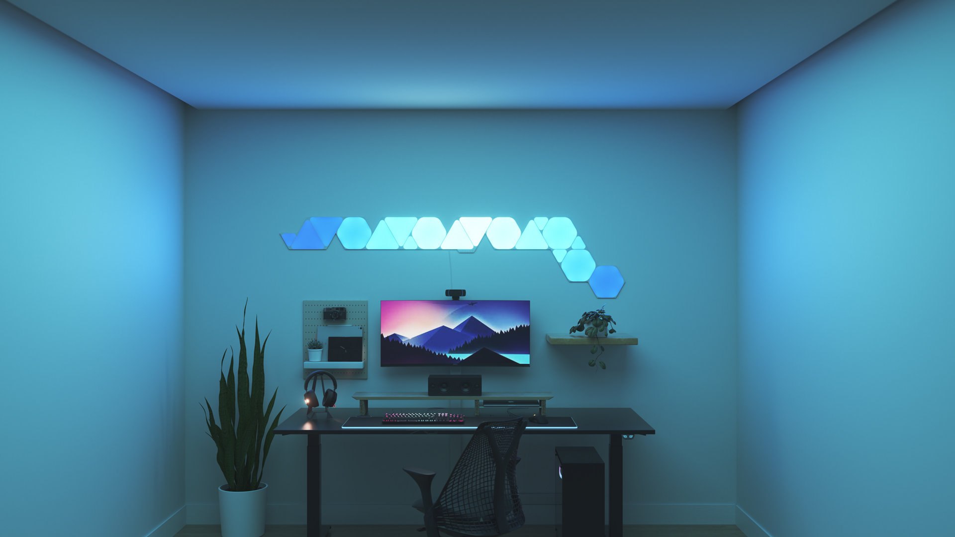 Minimalistic style gaming setup with Nanoleaf Shapes smart home RGB light panels above the monitor. PC games are better with these gaming lights.