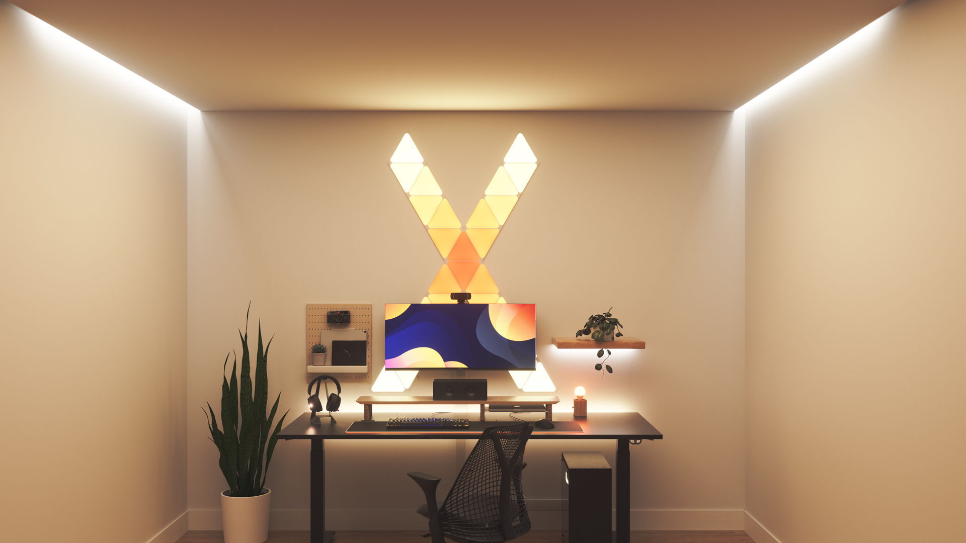 Kawaii style gaming setup with Nanoleaf Shapes Triangle smart home RGB light panels above the PC monitor. The perfect smart lights to complete the gamer aesthetic.