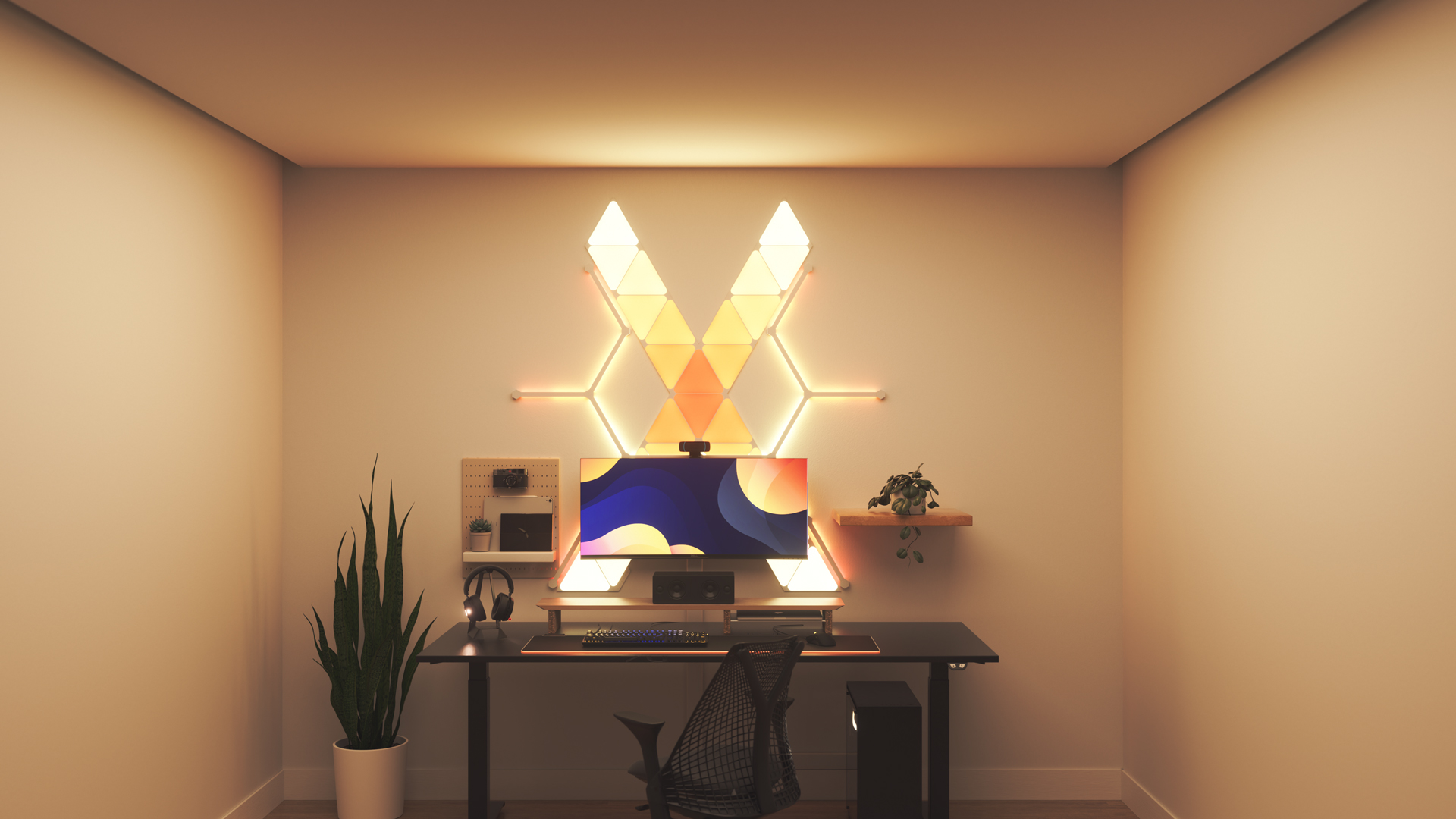 Kawaii style gaming setup with Nanoleaf Shapes Triangle smart home RGB light panels above the PC monitor. The perfect smart lights to complete the gamer aesthetic.