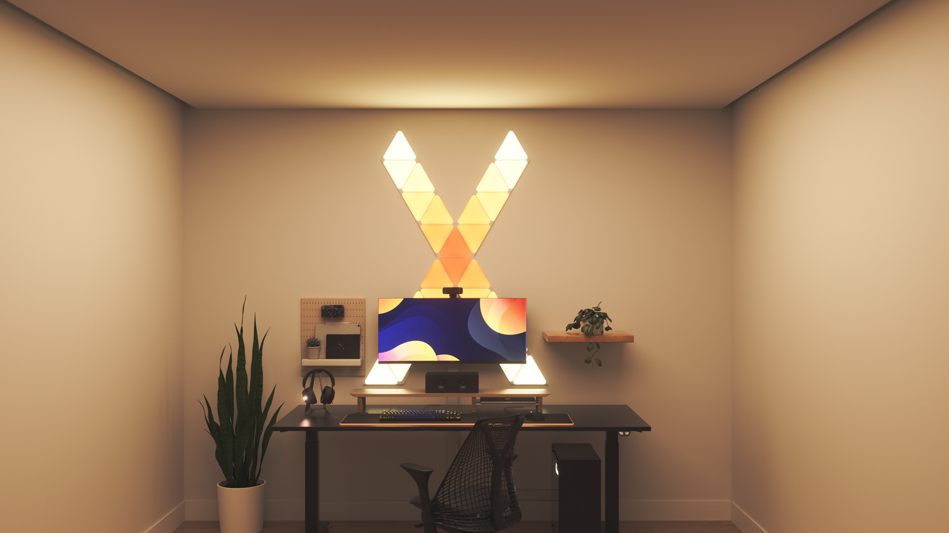 Kawaii style gaming setup with Nanoleaf Shapes Triangle smart home RGB light panels above the PC monitor. The perfect smart lights to complete the gamer aesthetic.