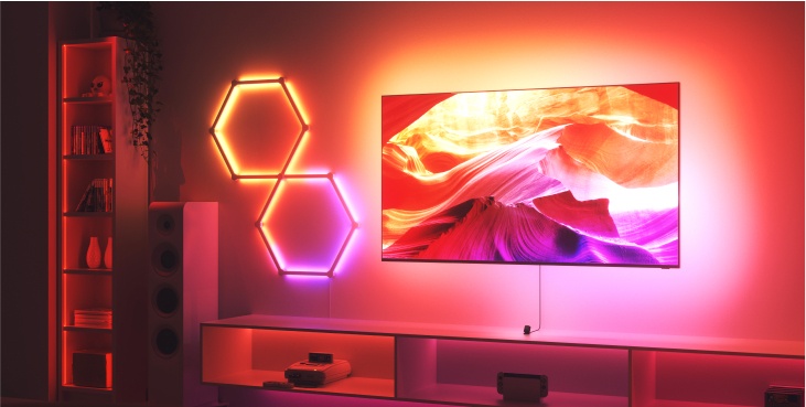 Office bedroom setup with Nanoleaf Lines RGB lights mounted above the desk and monitor. The perfect gaming lights for your PC battlestation.